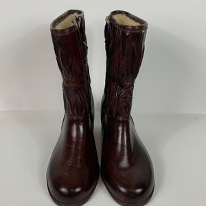 NWOT Brown calf high boots size 7 WW. Zipper on the inside. Has fur lining